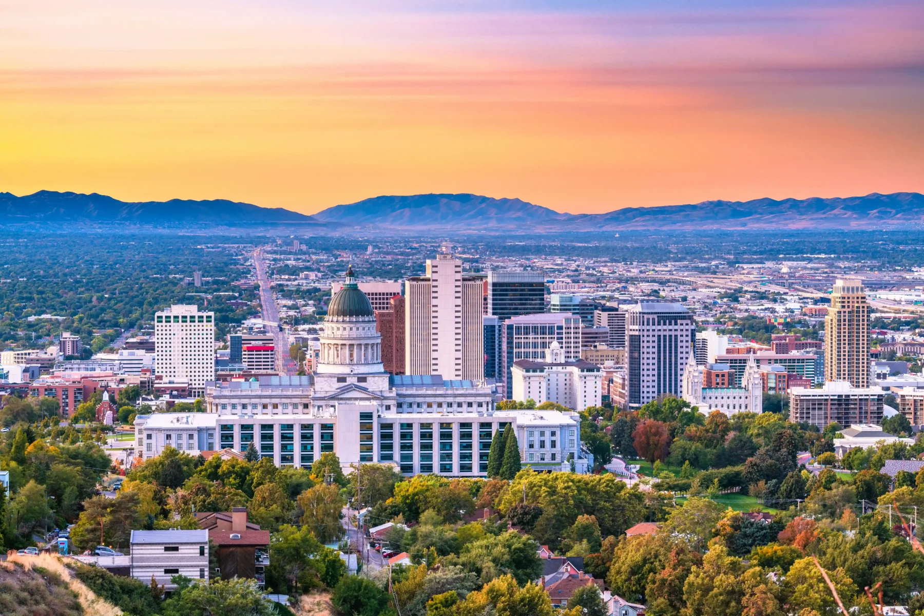 Aerial view of Salt Lake City Utah Skyline, tall buildings in the foreground, mountains in the distance