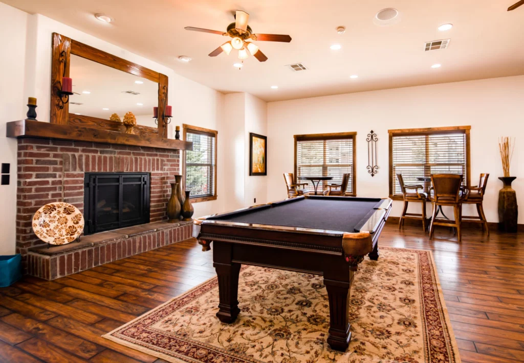 Clubhouse lounge with billiards table and fireplace
