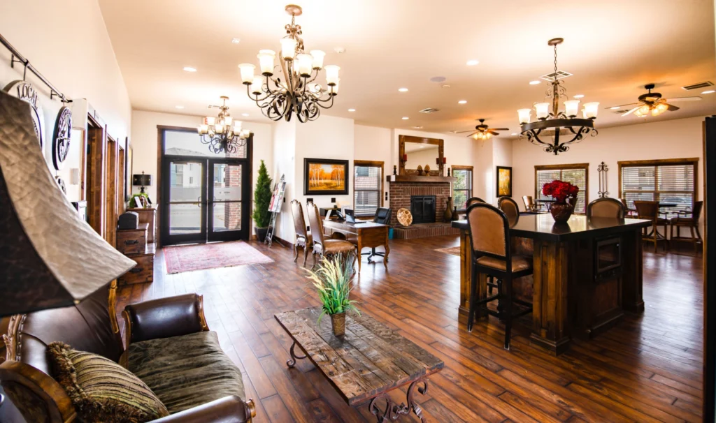 Clubhouse lounge with tables and chairs and fireplace