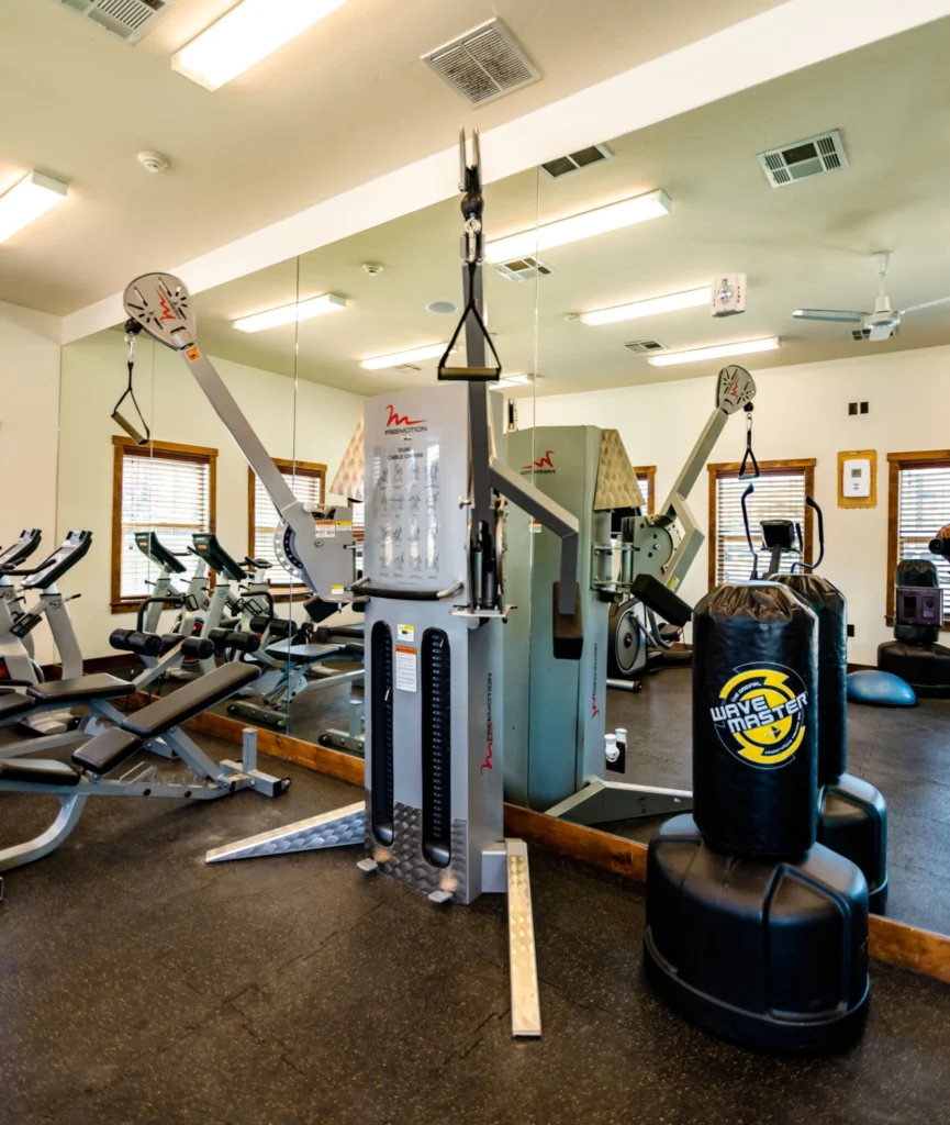 Fitness center with strength training equipment and cardio machines
